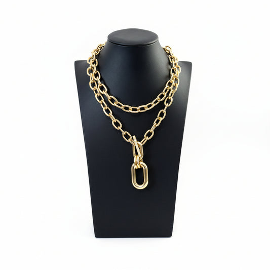 Two gold layered necklaces displayed on a mannequin, one in chocker style and the other Y style with a pendant.