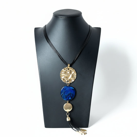 Necklace with decorative pendant on a black mannequin bust