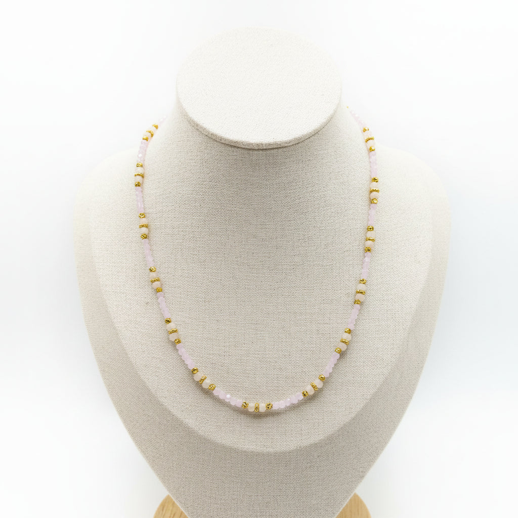 Rapunzel light pink beaded necklace with gold stainless steel accents and marbled crystals.