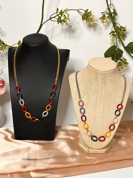 Estela gold-plated stainless steel necklace with a polished oval acrylic pendant.