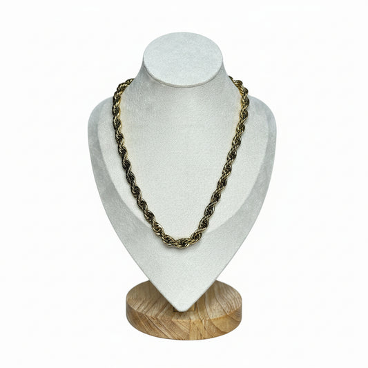 Serena twist chain necklace in 18K gold plated titanium stainless steel displayed on a mannequin.
