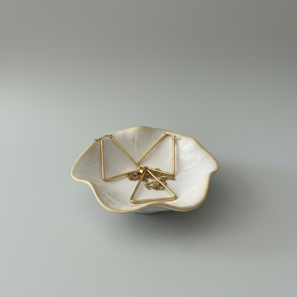 Lustrous Geometry gold titanium triangle necklace and matching earrings set.