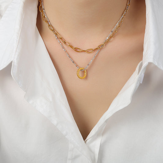 I Adore You double layer natural stone necklace with 18K gold plated circle pendant worn by a woman.