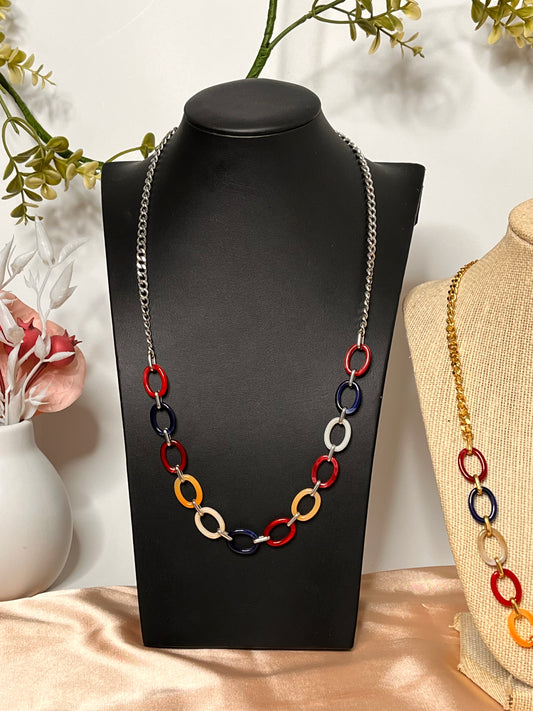Estela gold-plated stainless steel necklace with a polished oval acrylic pendant.