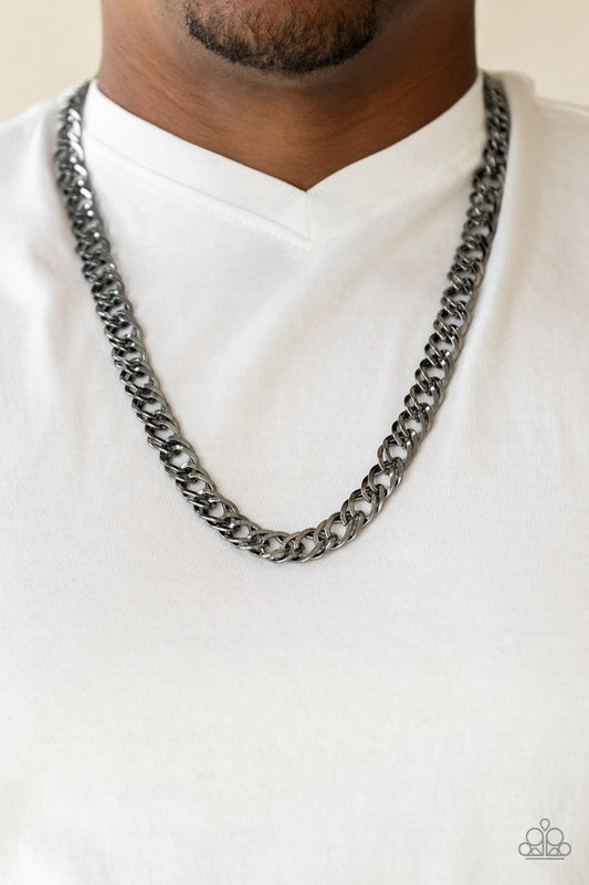Featuring doubled links, a glistening gunmetal chain drapes across the chest for a bold look. Features an adjustable clasp closure.  Sold as one individual necklace.